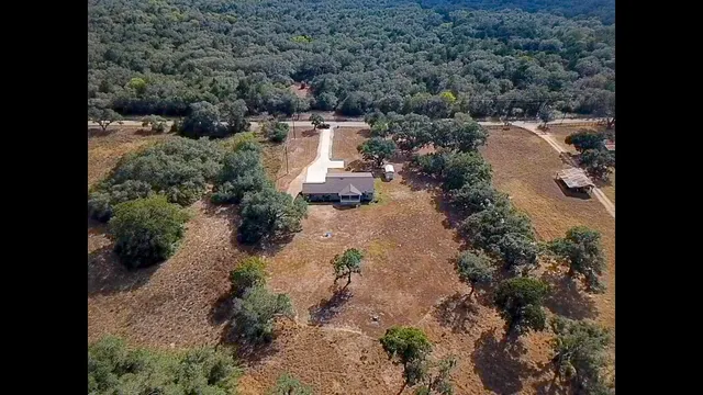 a view of a lake with beach and outdoor space