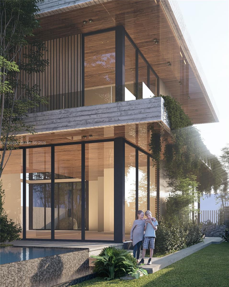 3700 Loquat Avenue Miami, FL 33133 - Photo 8 of 8 a front view of a house with a yard