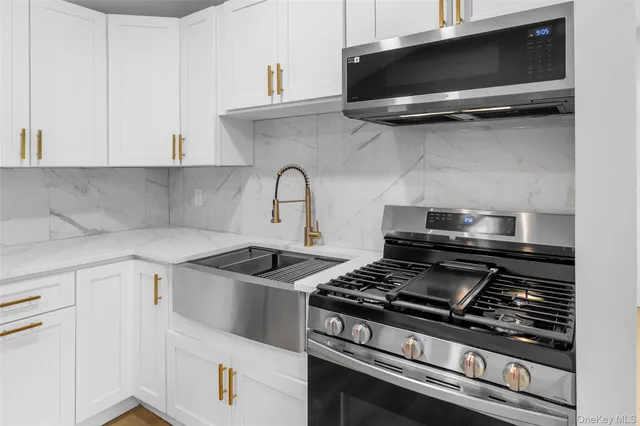 a kitchen with a stove and a microwave