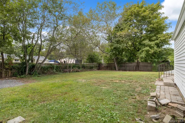 a backyard of a house with lots of green space