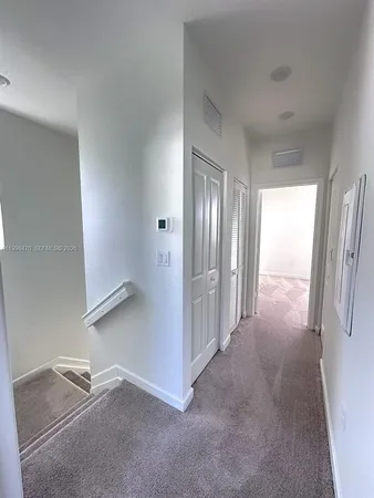 a view of a hallway with closet