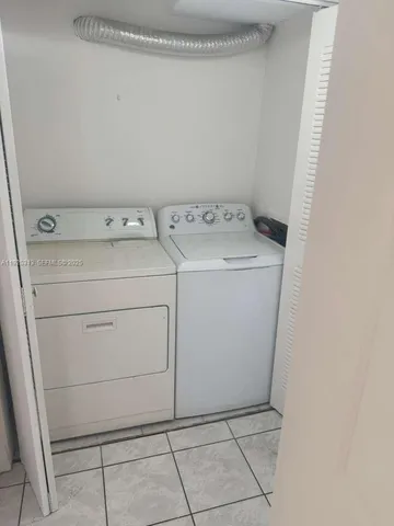 a view of balcony with yard