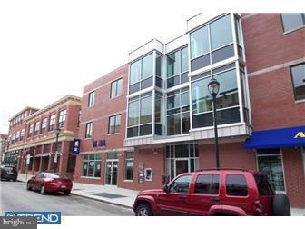 920 South Street, Unit 2 Philadelphia, PA 19147 - Photo 1 of 11 a front view of a building with lot of cars and trees