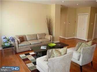 920 South Street, Unit 2 Philadelphia, PA 19147 - Photo 2 of 11 a living room with furniture and wooden floor