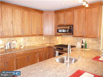 920 South Street, Unit 2 Philadelphia, PA 19147 - Photo 4 of 11 a kitchen with a sink cabinets and appliances