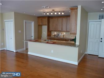 920 South Street, Unit 2 Philadelphia, PA 19147 - Photo 5 of 11 a view of a kitchen cabinets and wooden floor