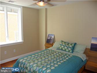 920 South Street, Unit 2 Philadelphia, PA 19147 - Photo 8 of 11 a bedroom with a bed and a window