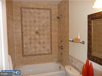 920 South Street, Unit 2 Philadelphia, PA 19147 - Photo 10 of 11 a bathroom with a shower and a toilet