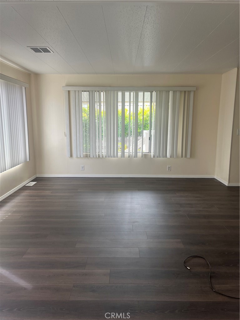 3950 Via Real, Unit 91 Carpinteria, CA 93013 - Photo 18 of 39 a view of wooden floor and windows in a room