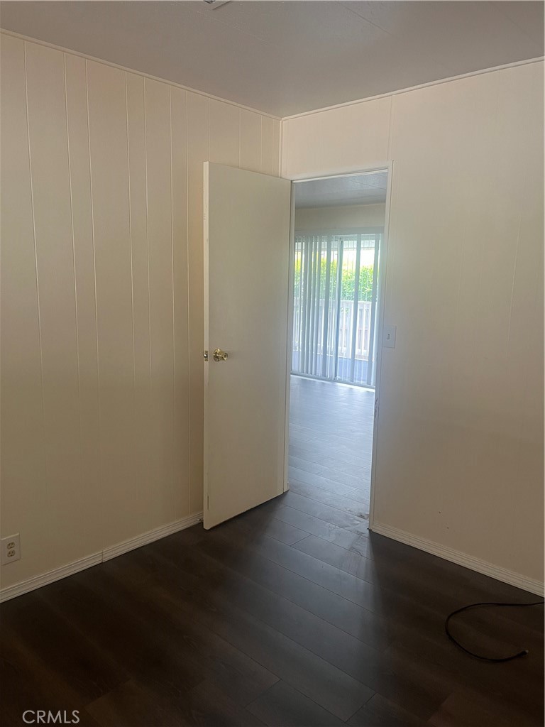 3950 Via Real, Unit 91 Carpinteria, CA 93013 - Photo 35 of 39 an empty room with wooden floor