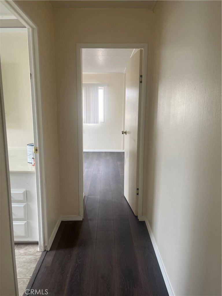3950 Via Real, Unit 91 Carpinteria, CA 93013 - Photo 36 of 39 a view of a hallway with wooden floor