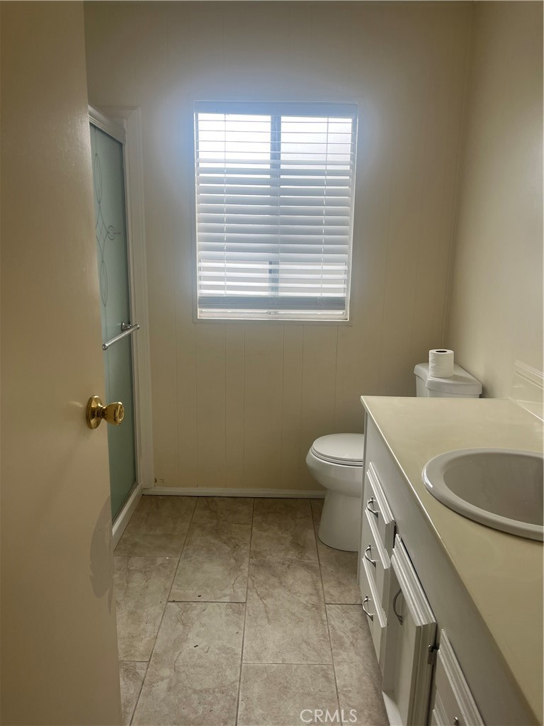 3950 Via Real, Unit 91 Carpinteria, CA 93013 - Photo 37 of 39 a bathroom with a sink a toilet and a window
