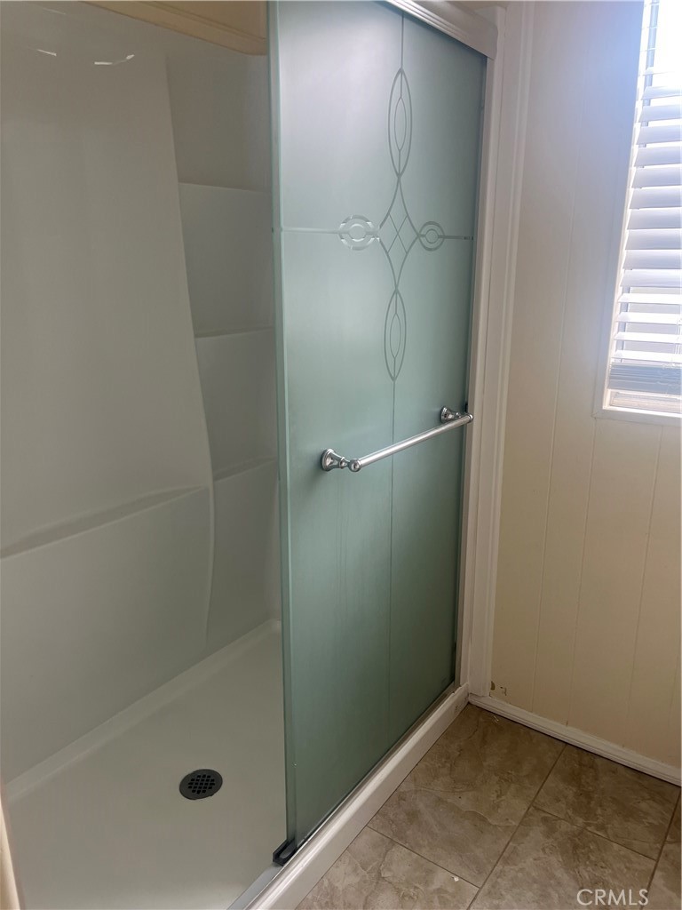 3950 Via Real, Unit 91 Carpinteria, CA 93013 - Photo 39 of 39 a bathroom with a glass shower door