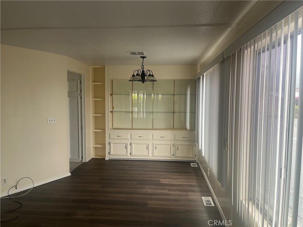 3950 Via Real, Unit 91 Carpinteria, CA 93013 - Photo 4 of 39 a view of empty room with wooden floor and fan