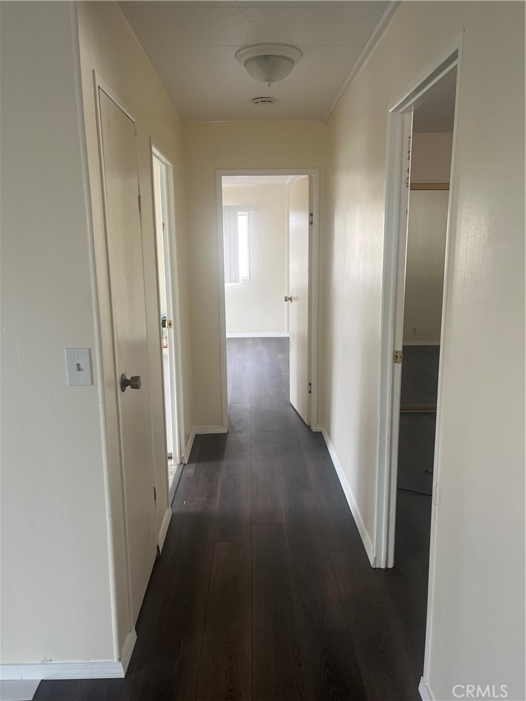 3950 Via Real, Unit 91 Carpinteria, CA 93013 - Photo 5 of 39 a view of a hallway with wooden floor