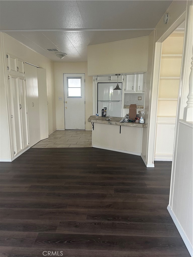 3950 Via Real, Unit 91 Carpinteria, CA 93013 - Photo 10 of 39 a view of empty room with wooden floor and fan