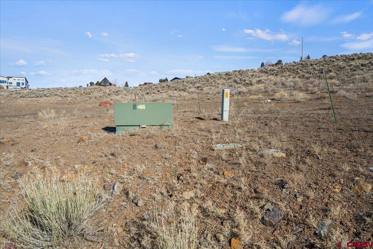 Tbd Tbd Mall Road Ridgway, CO 81432 - Photo 20 of 26 a view of a dry yard with mountains in the background