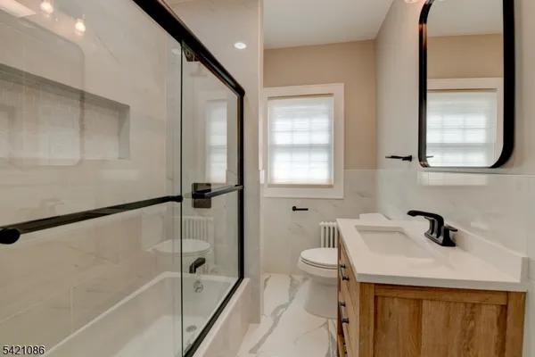 a bathroom with a sink a toilet and a bathtub