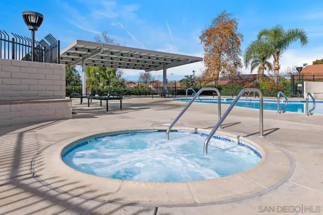 a view of a swimming pool with a lounge chair