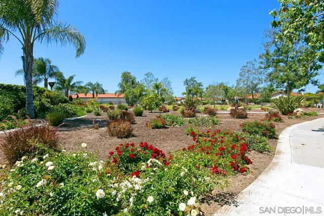 an outdoor view with swimming pool and seating space