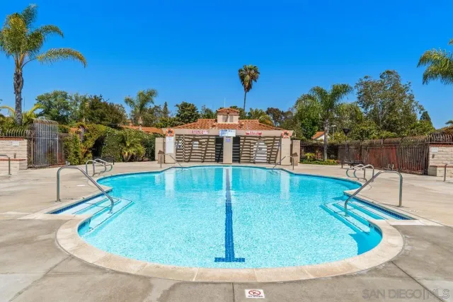 a view of a backyard with a garden and entertaining space