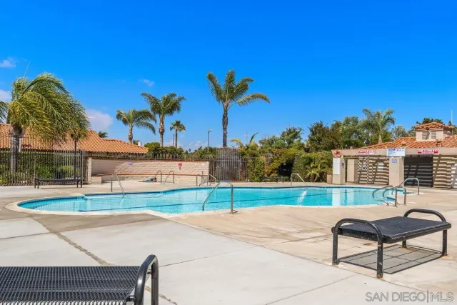 a building outdoor space with patio furniture and potted plants