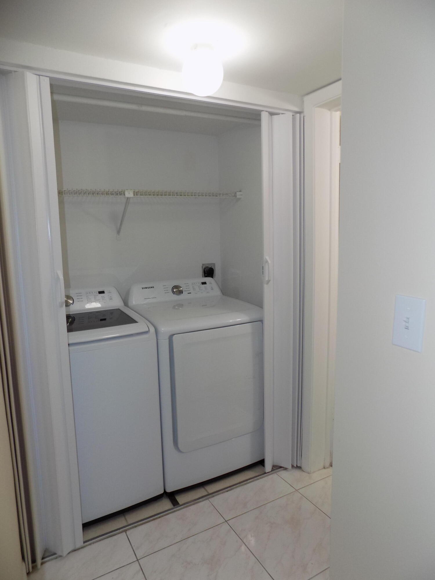 4181 South 57th Avenue, Unit B Greenacres, FL 33463 - Photo 15 of 25 a utility room with dryer and washer