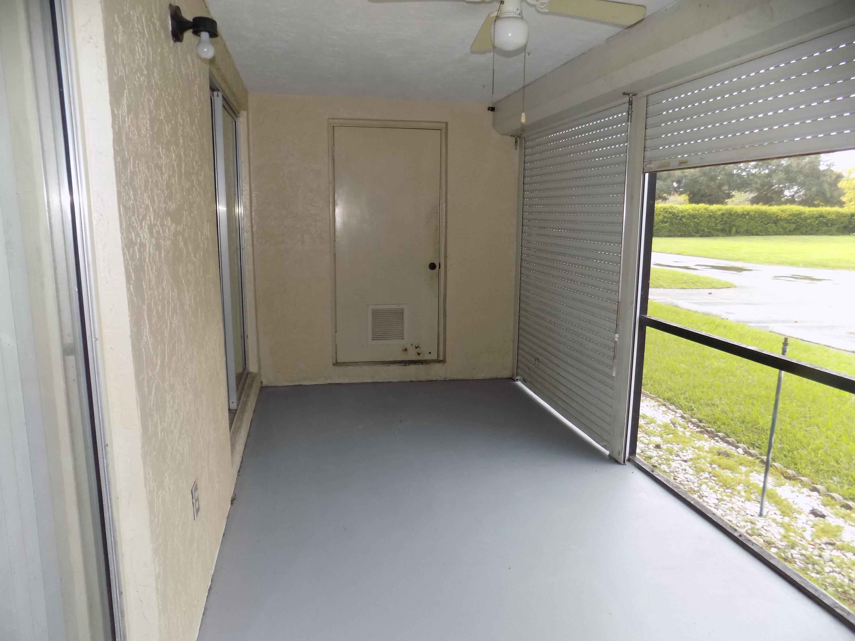 4181 South 57th Avenue, Unit B Greenacres, FL 33463 - Photo 19 of 25 a view of an empty room and a window