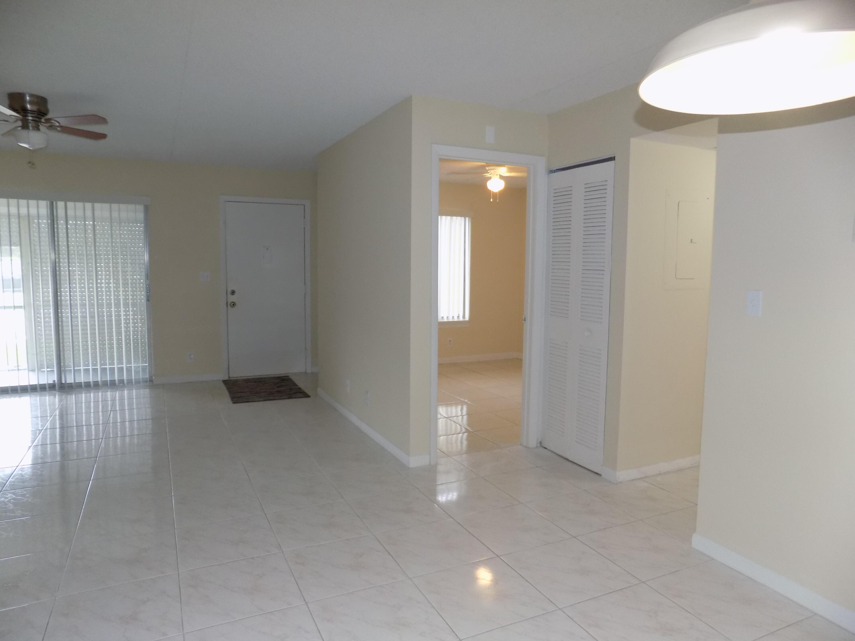 4181 South 57th Avenue, Unit B Greenacres, FL 33463 - Photo 7 of 25 a view of a room with wooden floor