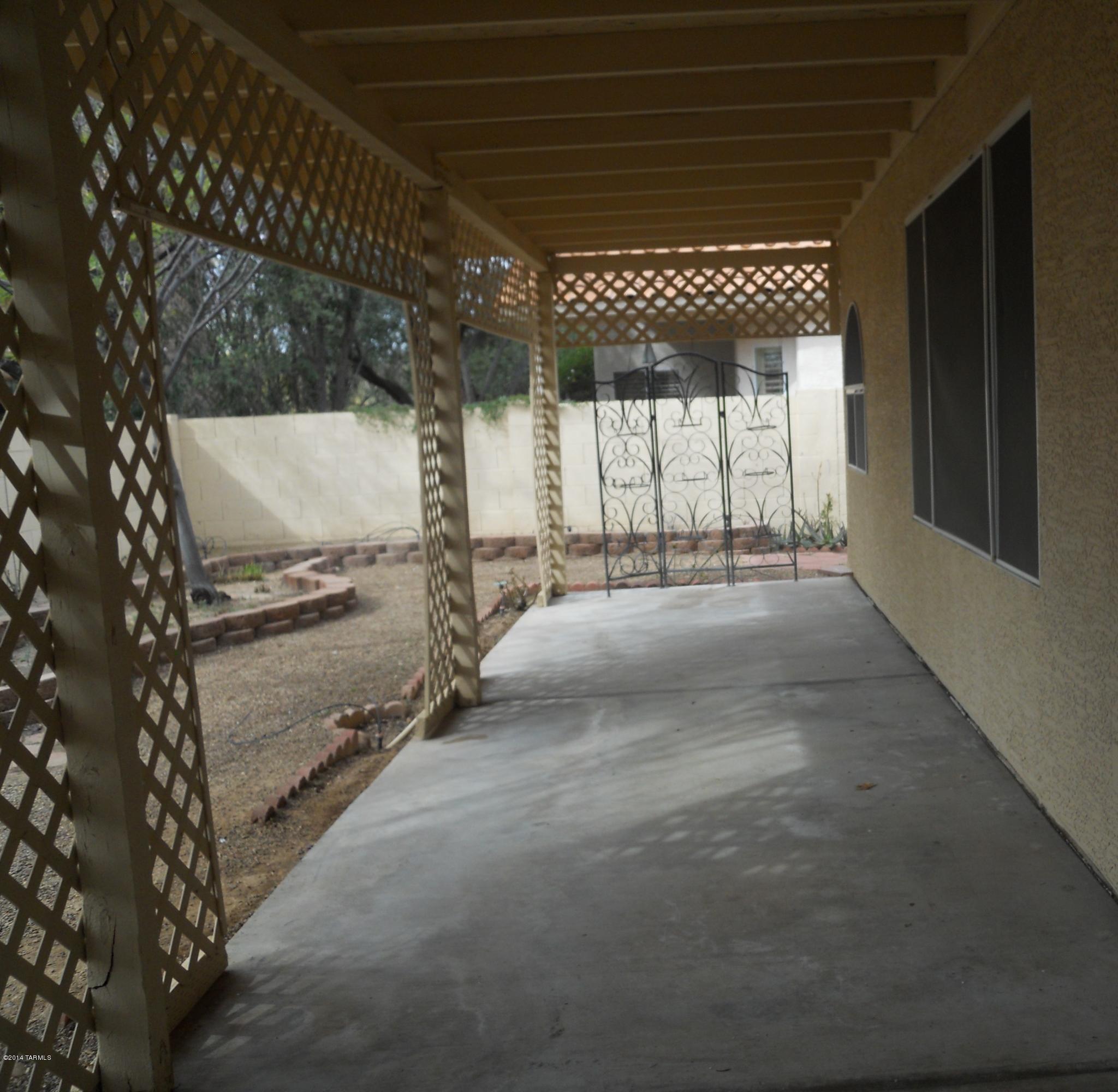 7736 East Elk Creek Road Tucson, AZ 85750 - Photo 10 of 11 a view of a room with wooden walls and windows