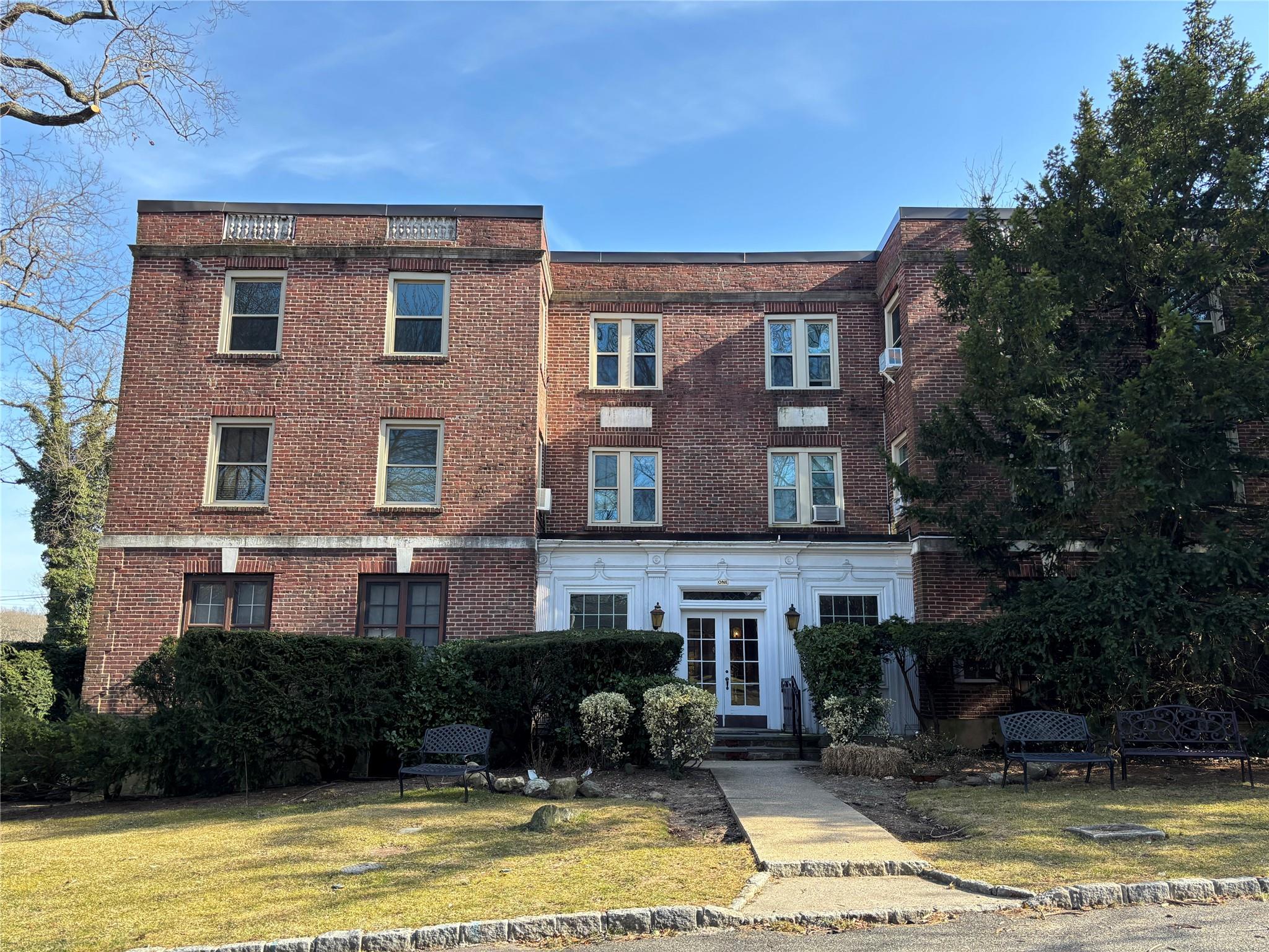 1 Ascot Ridge, Unit 3A Great Neck, NY 11021 - Photo 1 of 10 a front view of a house with a yard