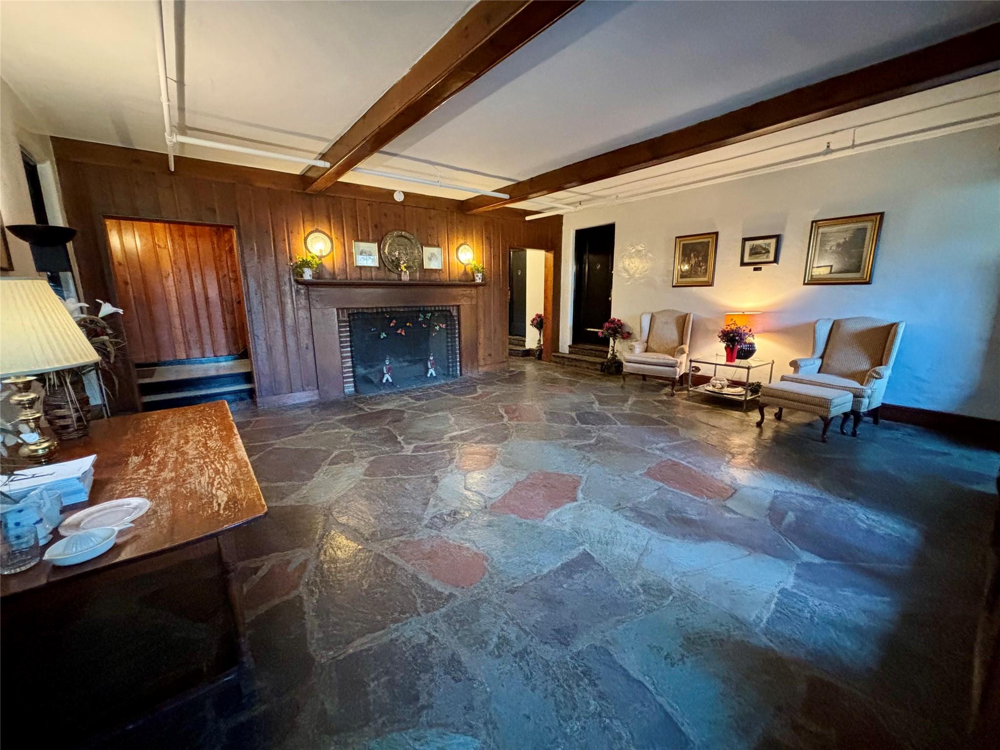 1 Ascot Ridge, Unit 3A Great Neck, NY 11021 - Photo 3 of 10 a living room with furniture and a fireplace