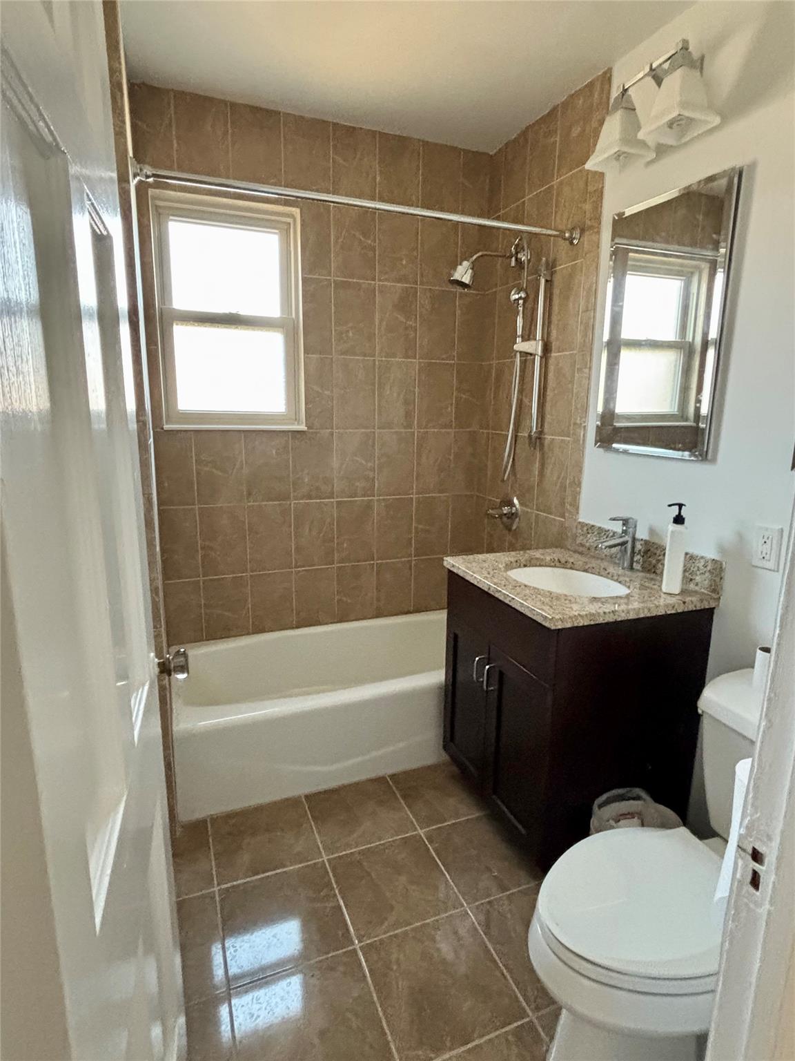 1 Ascot Ridge, Unit 3A Great Neck, NY 11021 - Photo 8 of 10 a bathroom with a sink a toilet and shower