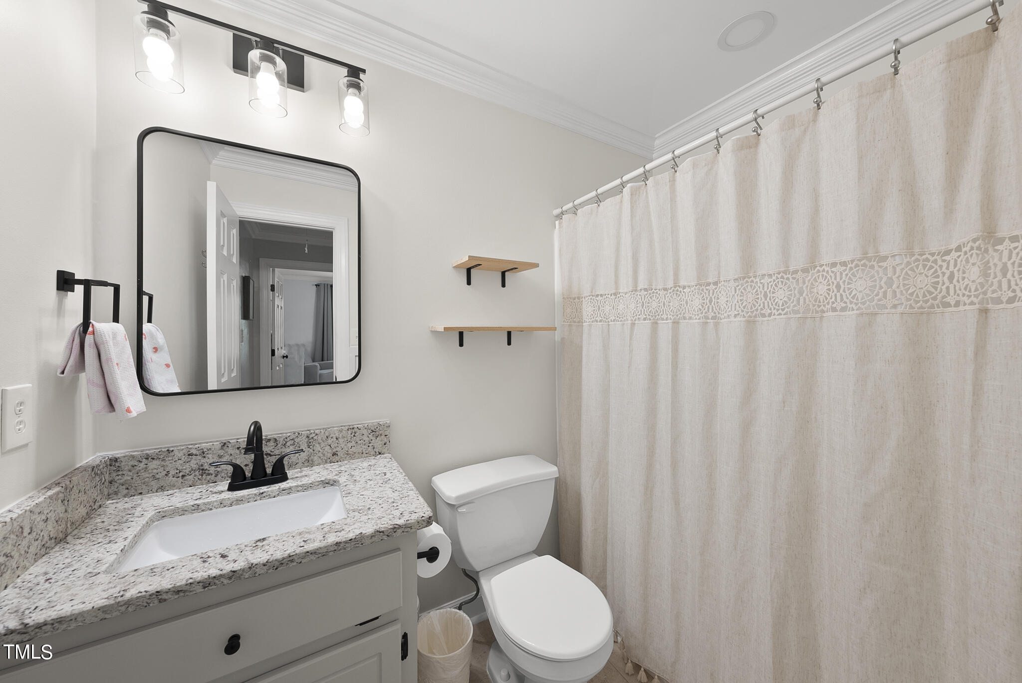 2821 Dahlgreen Road Raleigh, NC 27615 - Photo 16 of 28 a bathroom with a granite countertop sink vanity mirror and toilet