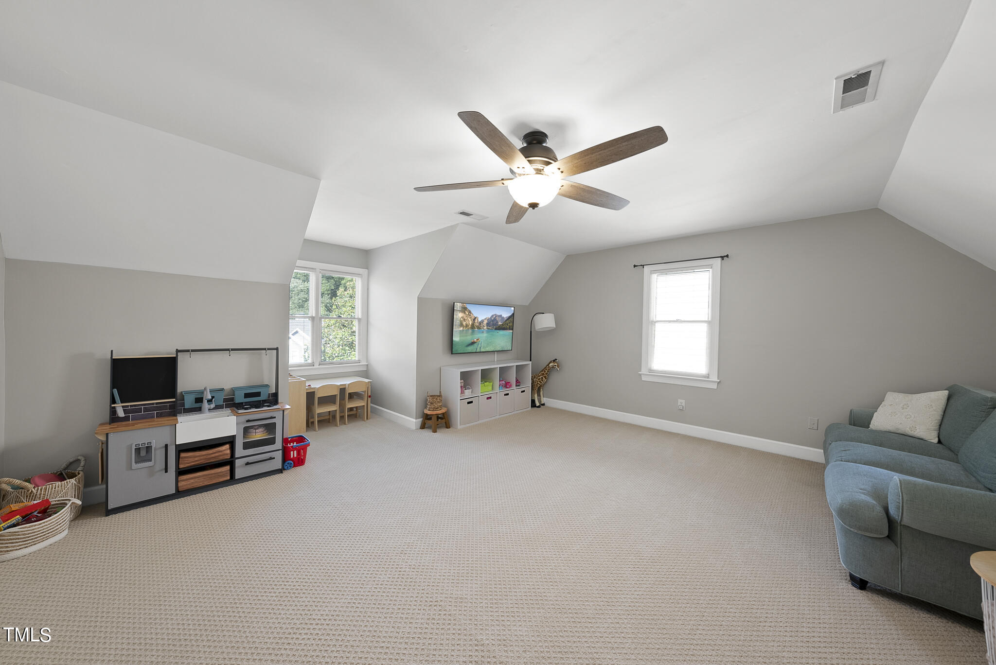 2821 Dahlgreen Road Raleigh, NC 27615 - Photo 17 of 28 a view of a livingroom with furniture and a flat screen tv
