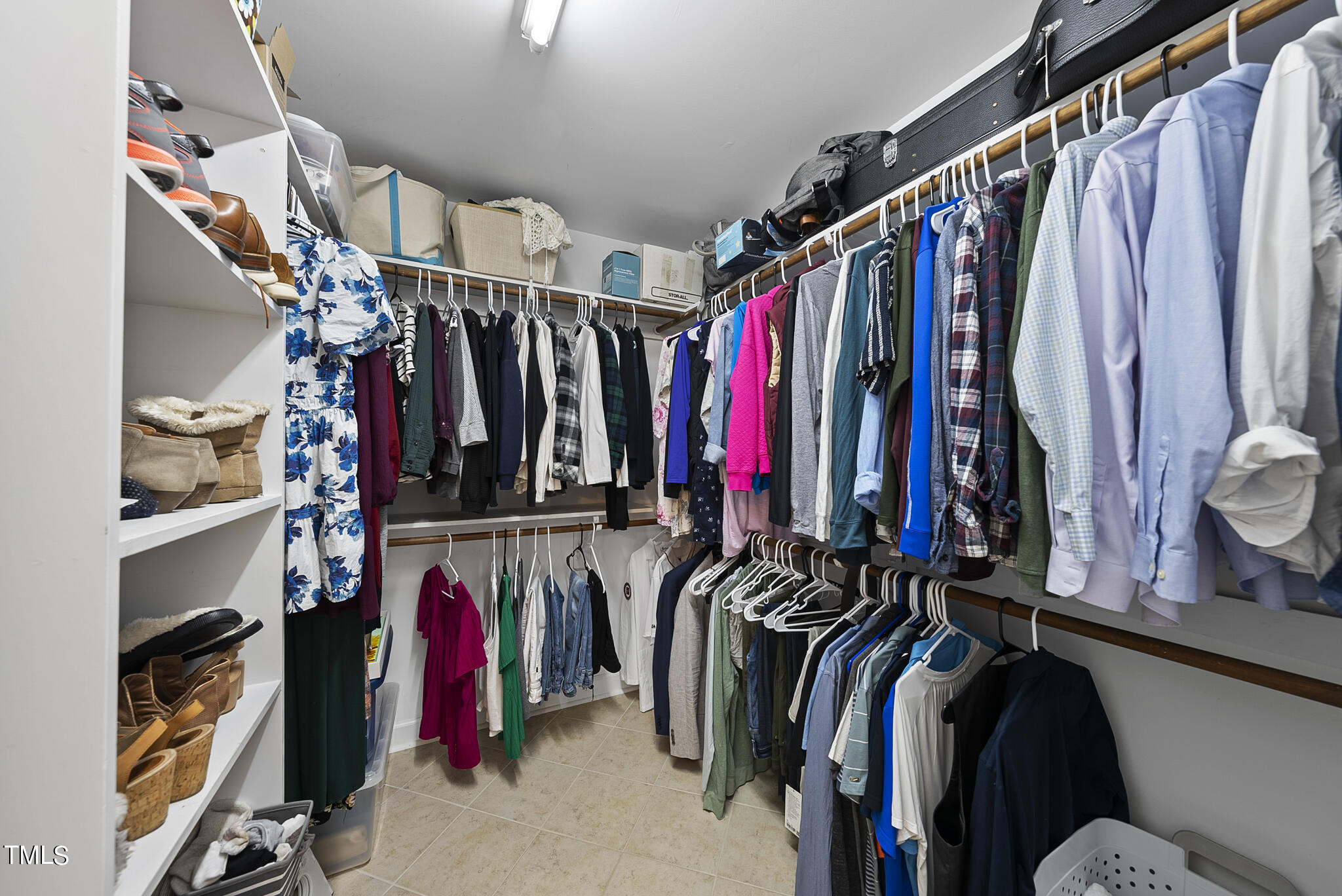 2821 Dahlgreen Road Raleigh, NC 27615 - Photo 22 of 28 a view of walk in closet with clothes and shoes