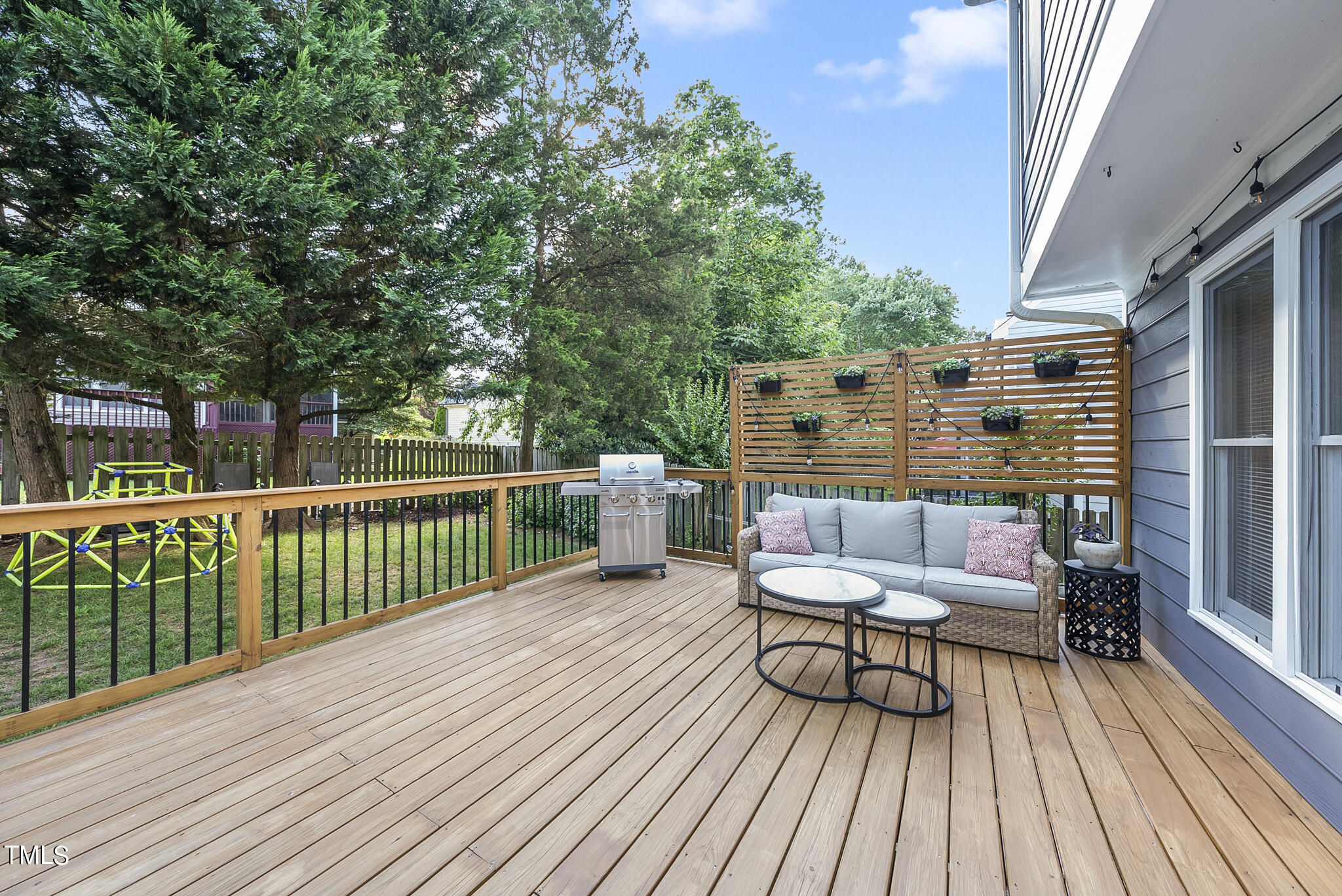 2821 Dahlgreen Road Raleigh, NC 27615 - Photo 25 of 28 a balcony with wooden floor table and chairs