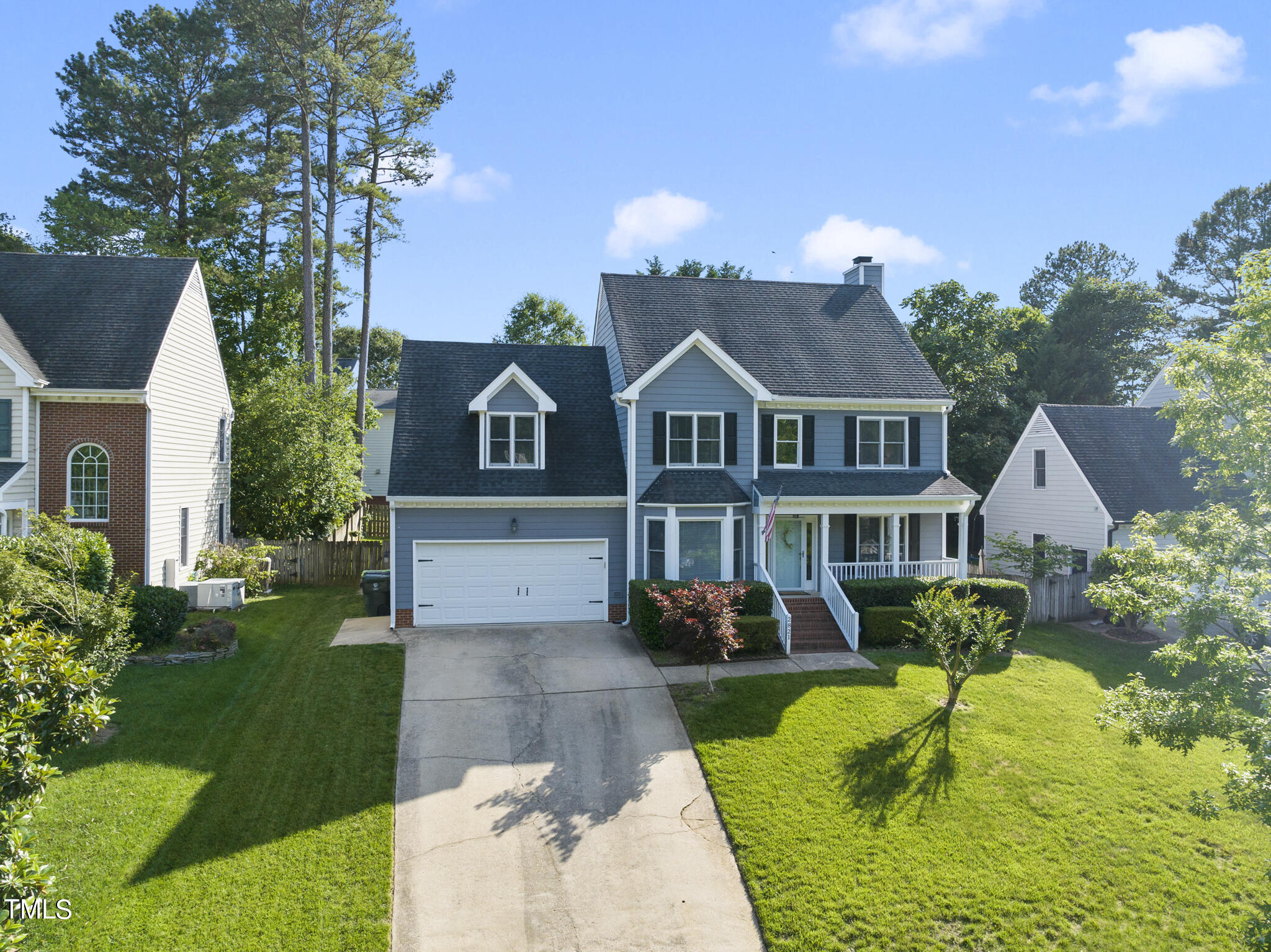2821 Dahlgreen Road Raleigh, NC 27615 - Photo 26 of 28 a front view of a house with a yard table and chairs