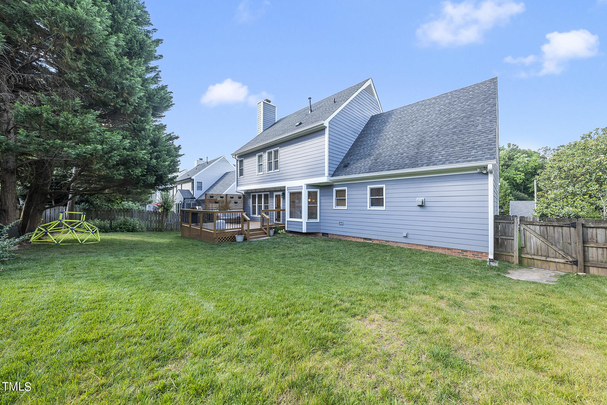 2821 Dahlgreen Road Raleigh, NC 27615 - Photo 27 of 28 a view of a house with a yard and sitting area