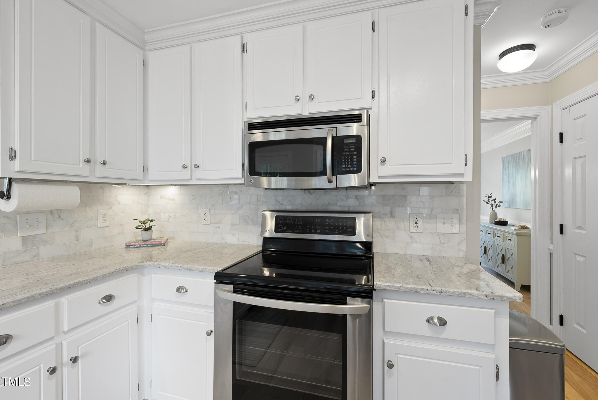 2821 Dahlgreen Road Raleigh, NC 27615 - Photo 3 of 28 a kitchen with granite countertop white cabinets and stainless steel appliances