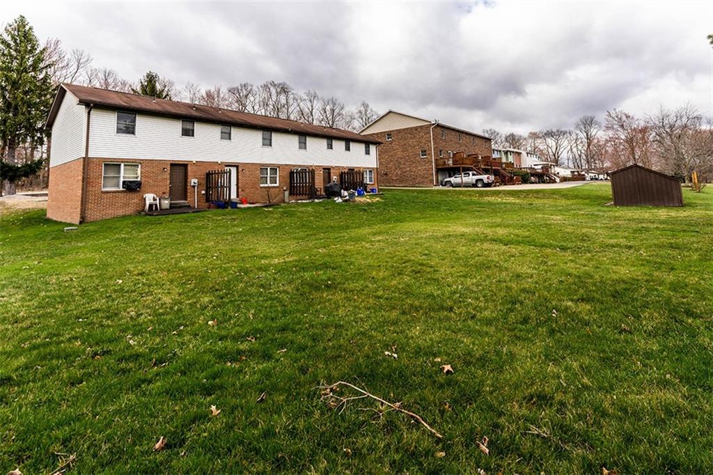 4867 Lucerne Road Indiana, PA 15701 - Photo 12 of 13 a view of a house with a big yard and large trees