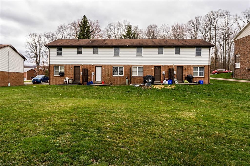 4867 Lucerne Road Indiana, PA 15701 - Photo 13 of 13 a view of a white house with a big yard and large trees