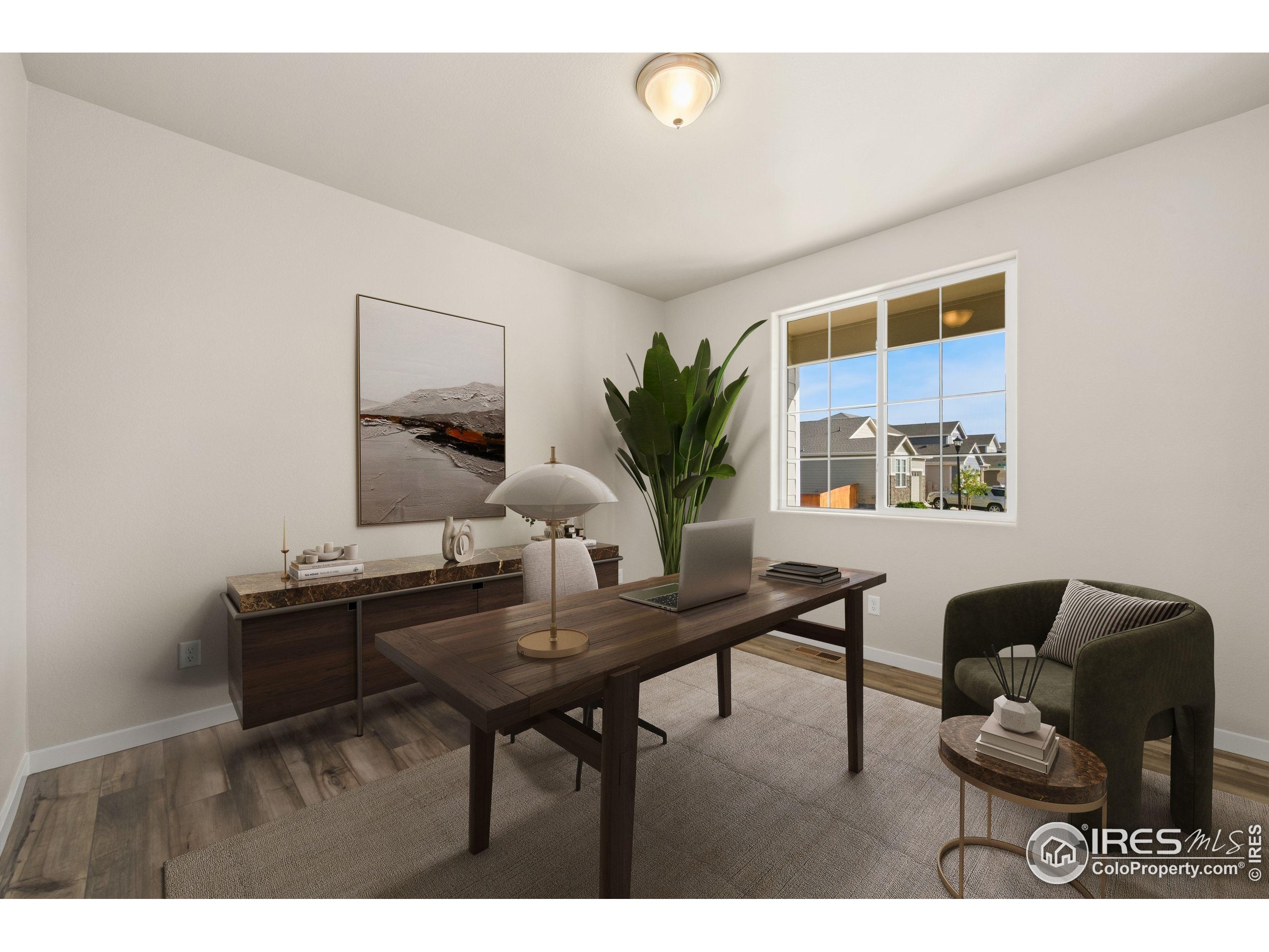 963 Milner Pass Road Severance, CO 80550 - Photo 15 of 42 a living room with furniture and a potted plant
