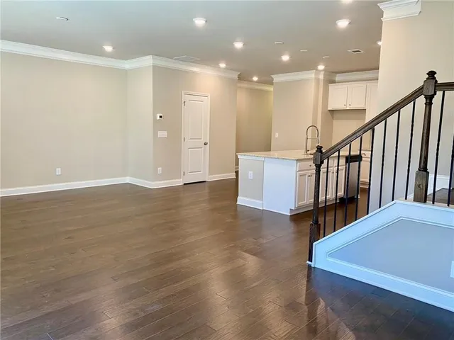 a view of a kitchen with wooden floor and a floor to ceiling window