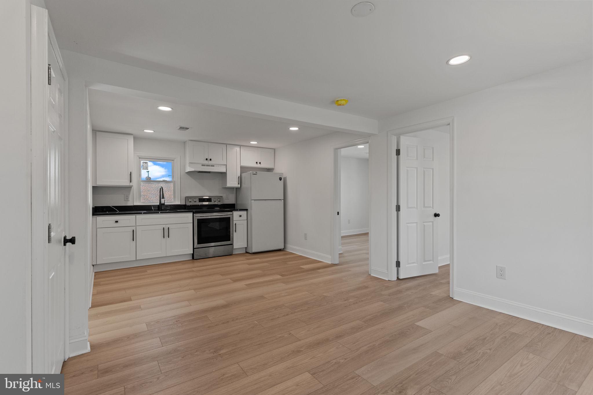 908 State Rd., Unit A Croydon, PA 19021 - Photo 3 of 9 a view of kitchen with granite countertop stainless steel appliances refrigerator sink and cabinets