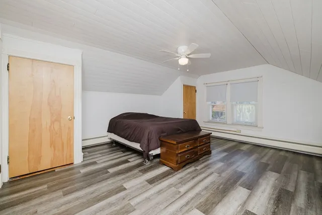 a living room with a bed furniture and a window