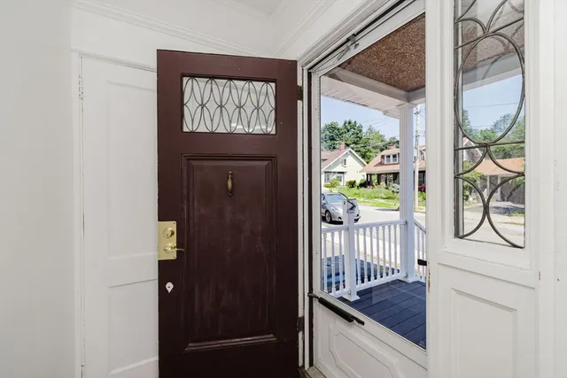 a view of front door door and wooden floor
