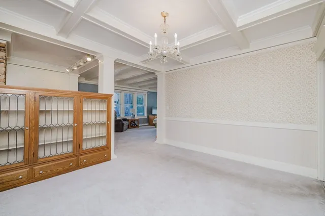 en empty room with windows and ceiling fan