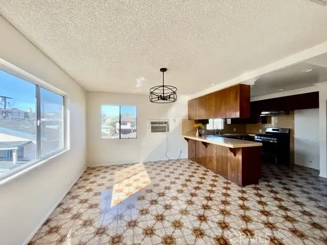a kitchen with a stove a sink and a refrigerator