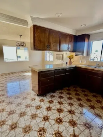 a kitchen with a sink and cabinets